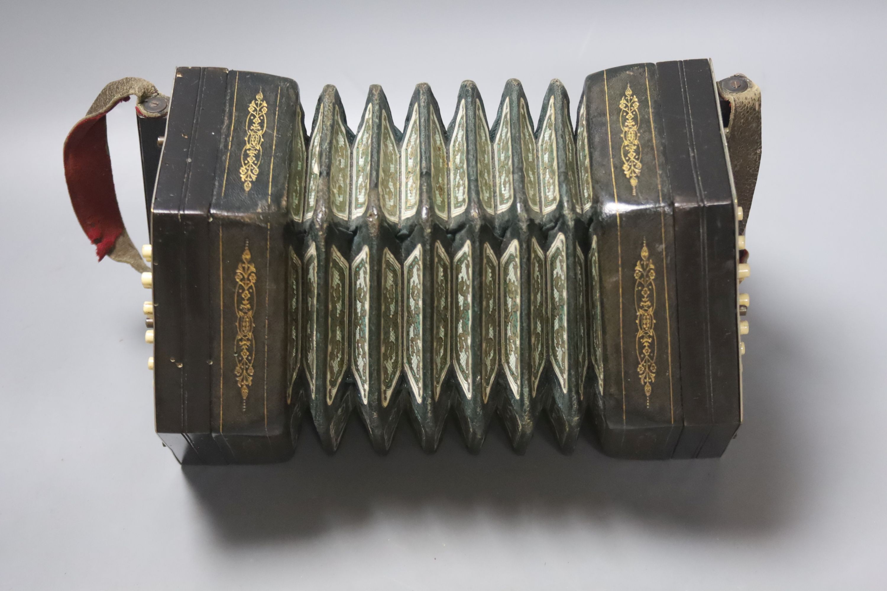 A Victorian 36 button concertina, with pierced nickel mounts, unsigned